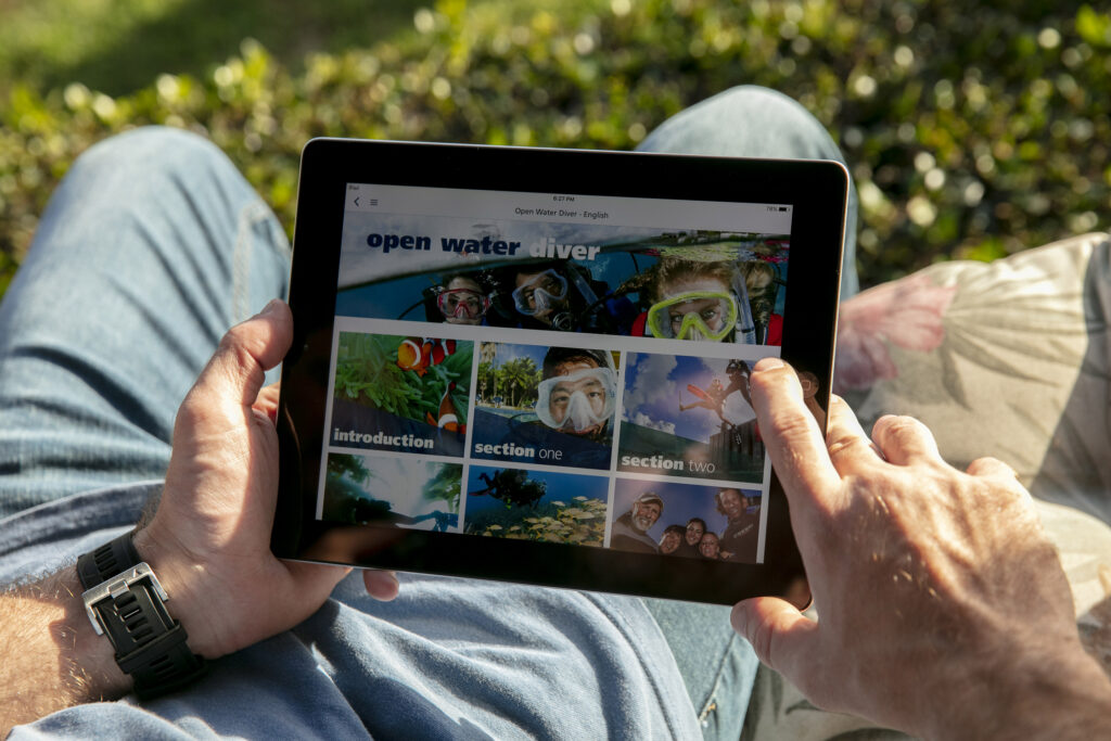 Student completing PADI scuba diving eLearning on a tablet